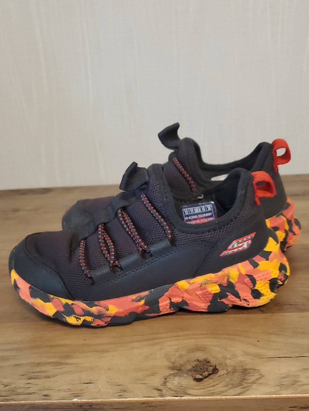 Skechers Kids Black Athletic Sneakers with Orange & Yellow Camouflage Sole